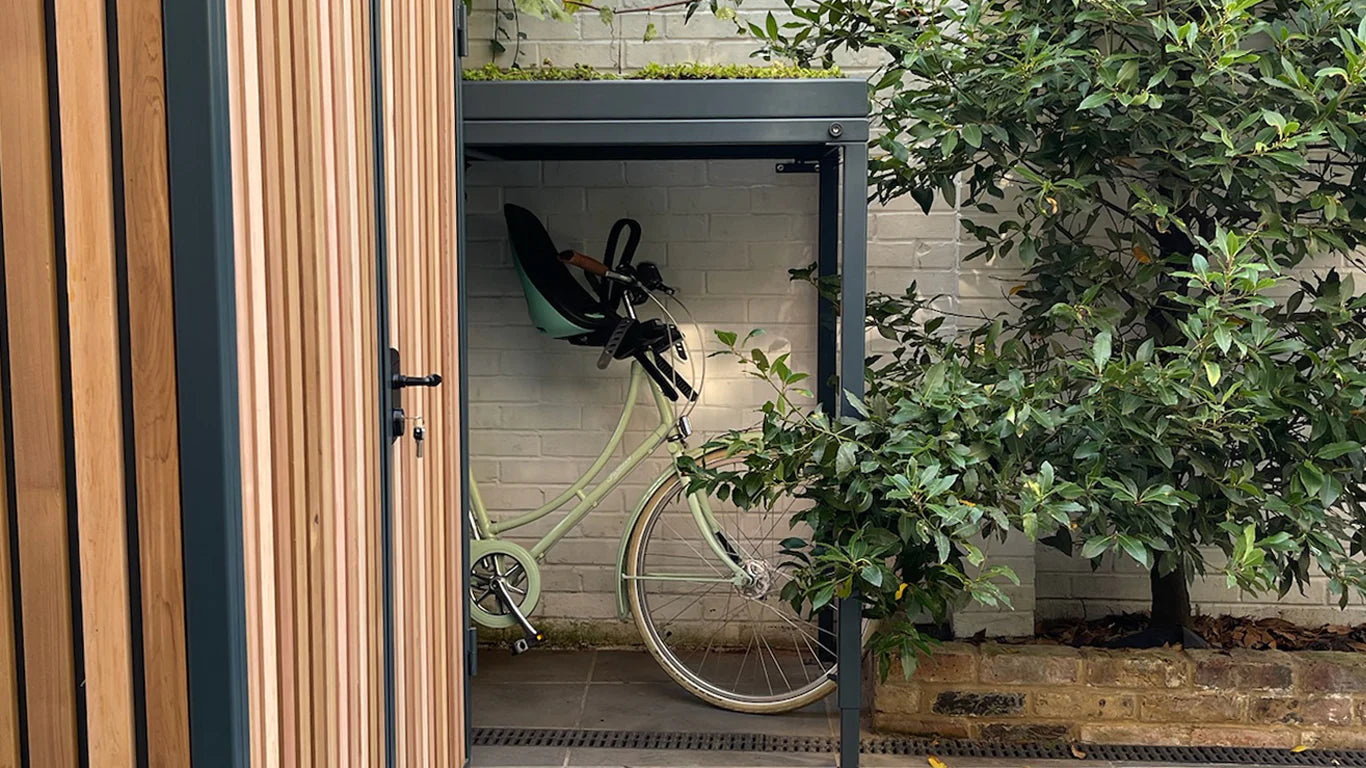 green roof bike shed and garden shed with red cedar cladding