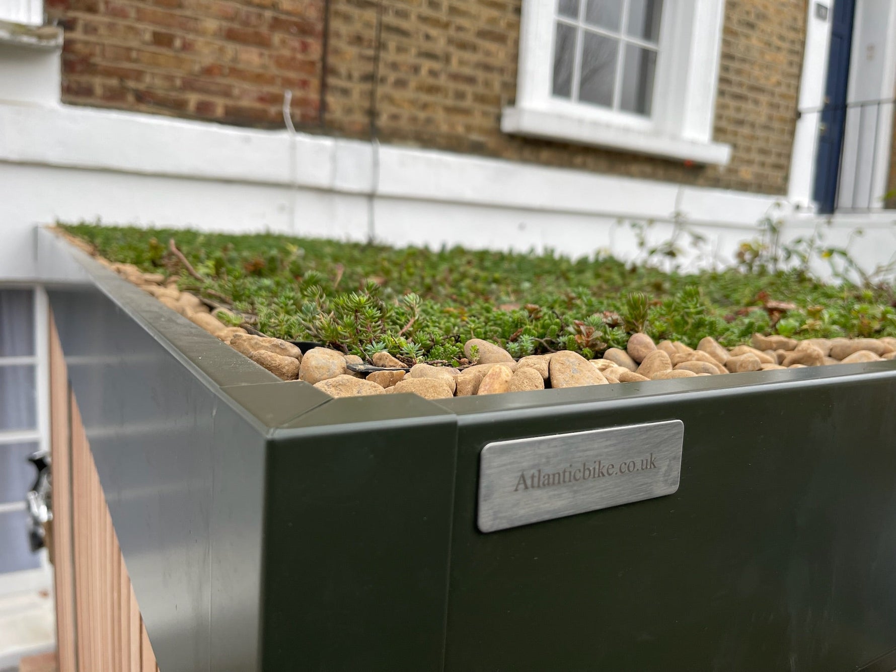 Atlanticbike bike shed with green roof in a London front garden