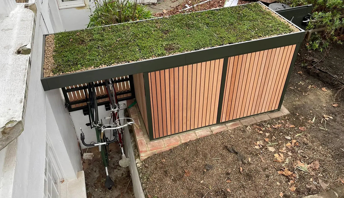 Overview from above of a bespoke Verde Uno with green roof extension over a vertical bike shelter