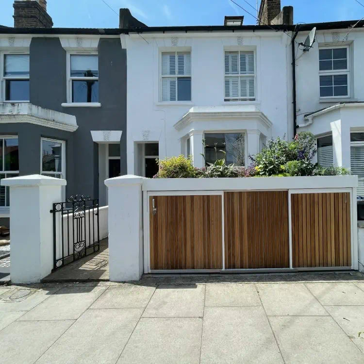 Completed front garden wall replacement in London with bespoke bike and bin store installed.