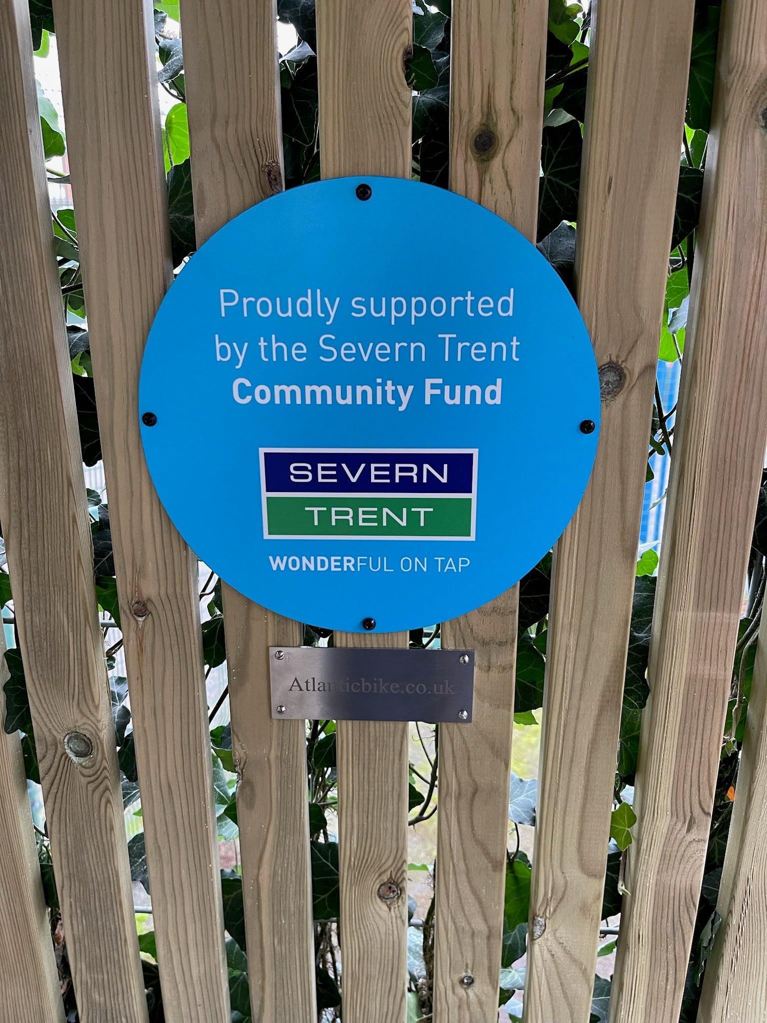 Atlanticbike green roof school bike shelter displaying “Trusted by Severn Rivers Trust” badge, highlighting credibility and environmental partnership.