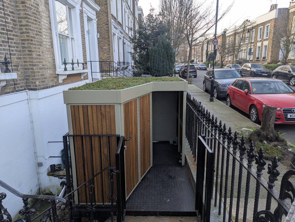 Animated demonstration of the cargo bike store’s double hinged door opening system for secure and space-saving front garden access.