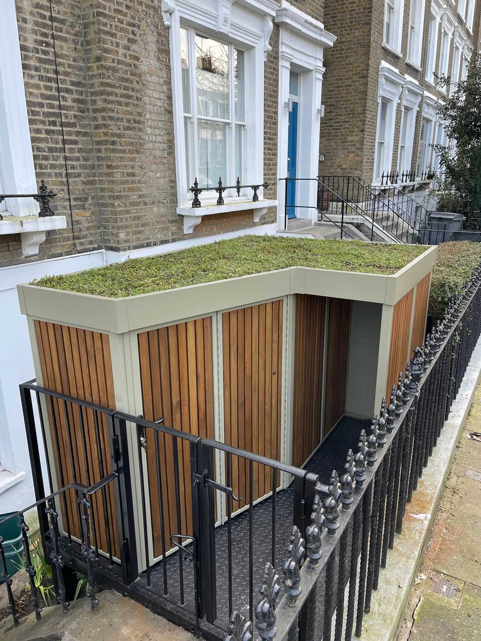 Overview of the Verde cargo bike and bin store featuring a lush green roof