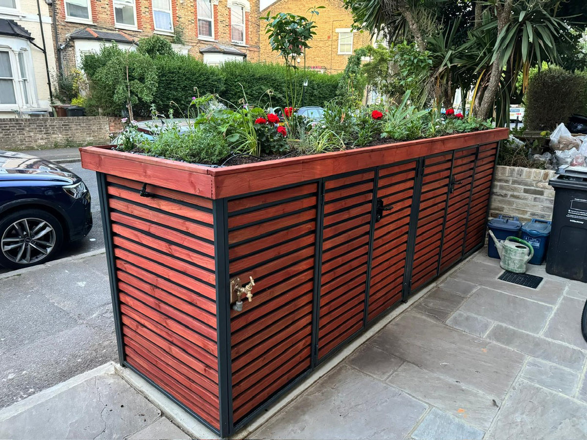 Verde Muro double compartment bike store with planted green roof, viewed from an angle after wall replacement.