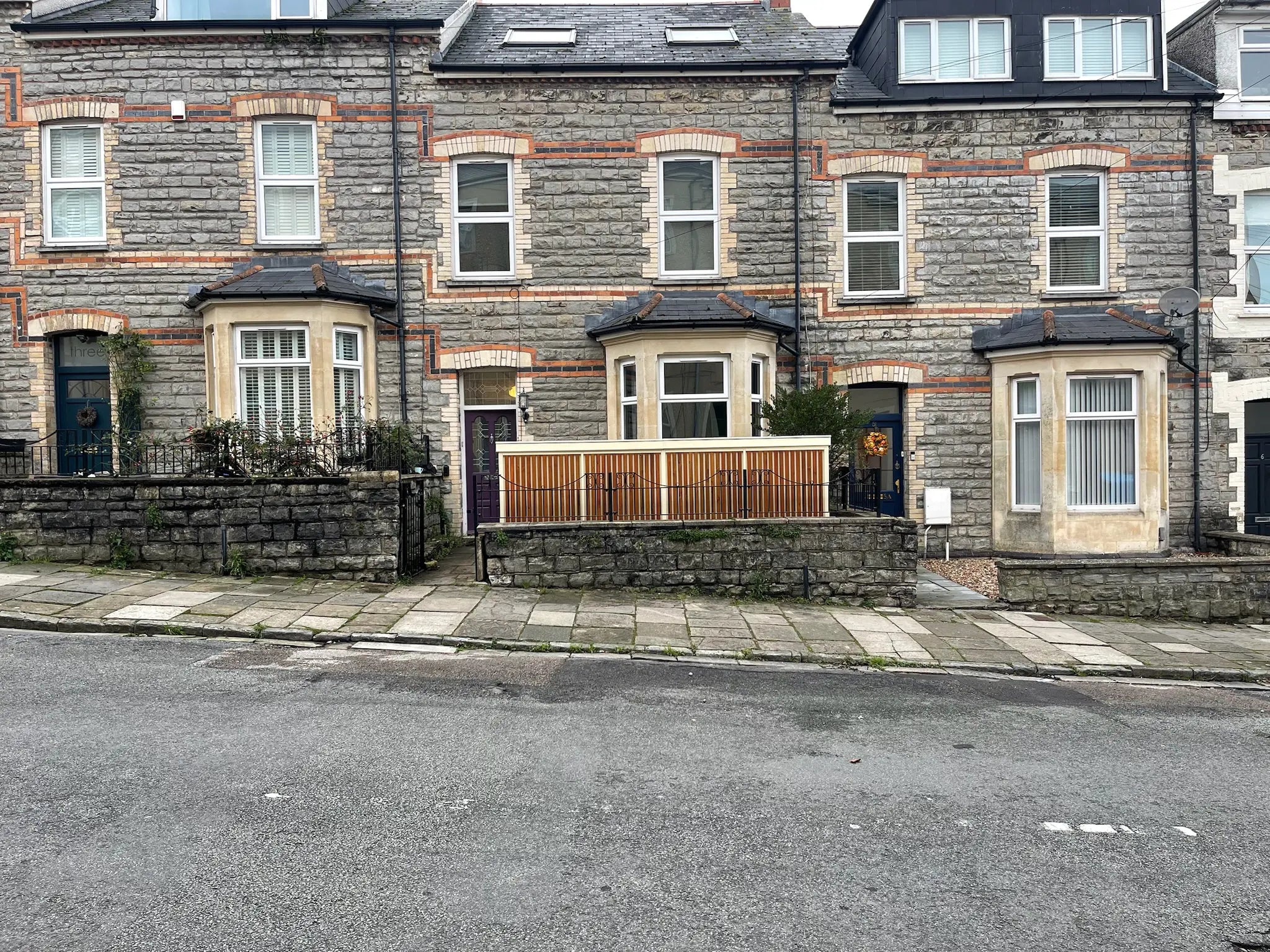 Street view of the bespoke Verde Plus bike shed integrated within its urban surroundings