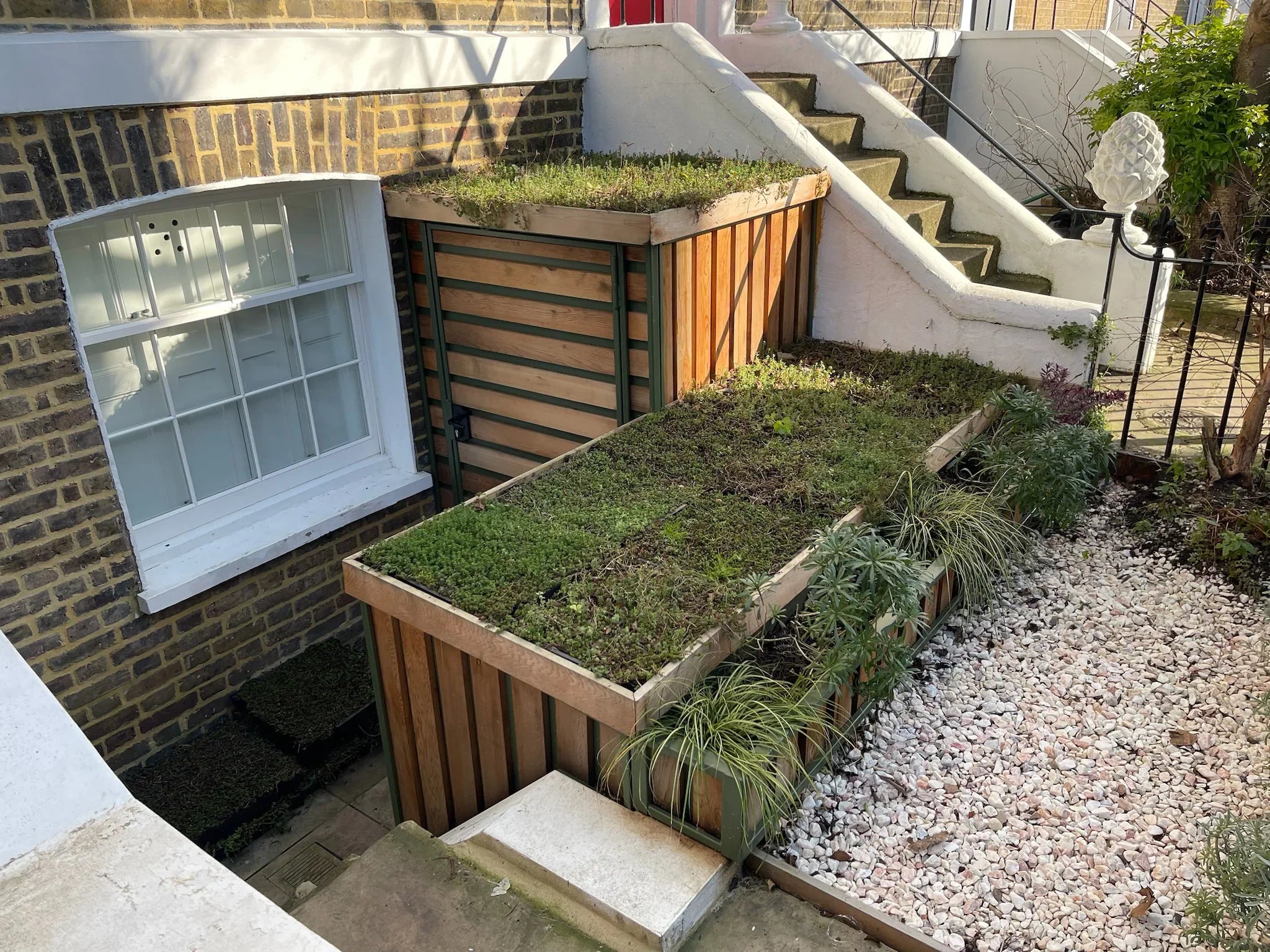 Green roof vertical and horizontal bike shed with side planter - green structure with timber cladding