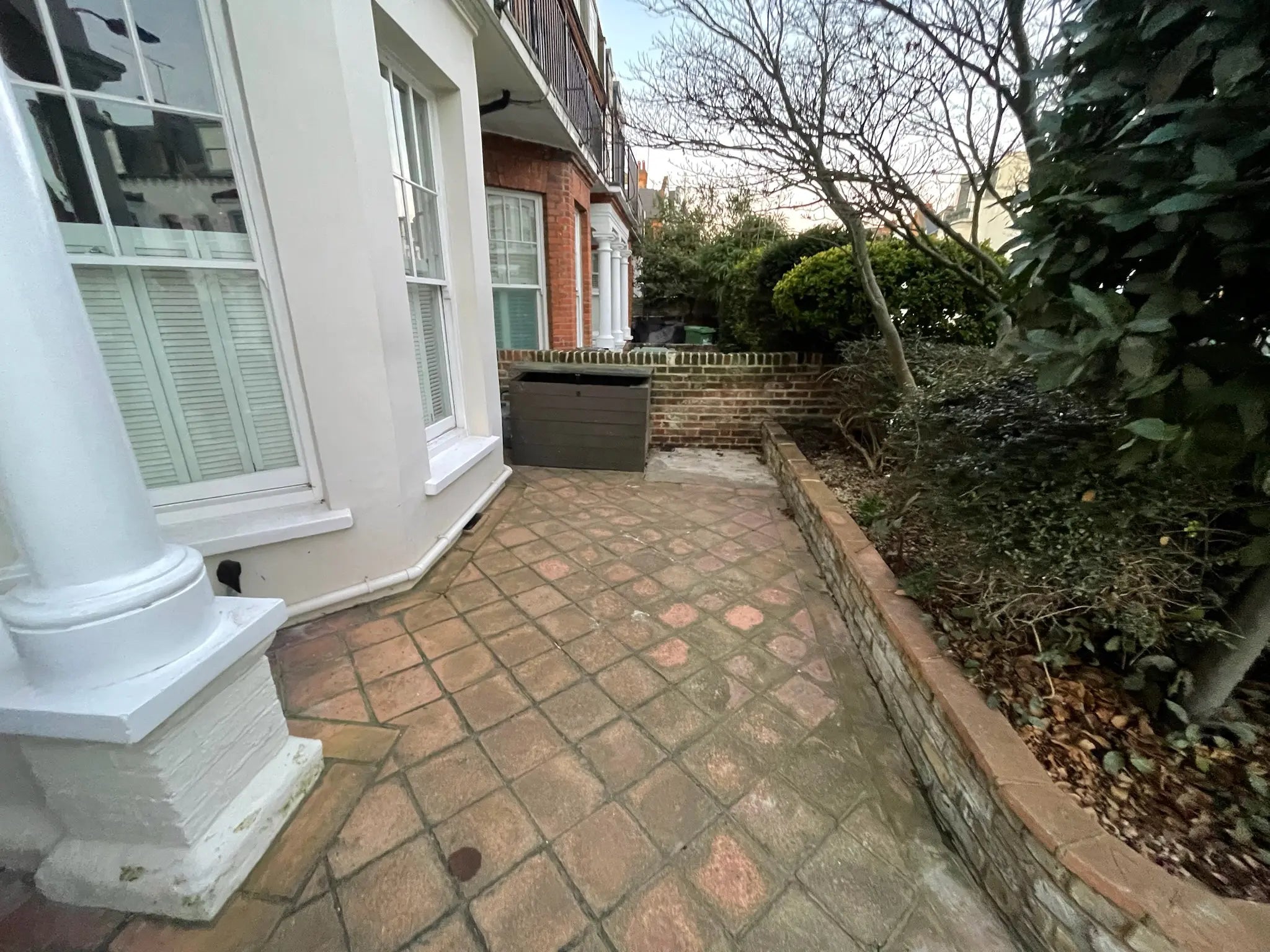 Before: Cluttered Front Garden with No Outdoor Storage