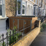 Bespoke bike shed seamlessly integrated into front garden, providing secure storage and maintaining aesthetic appeal.