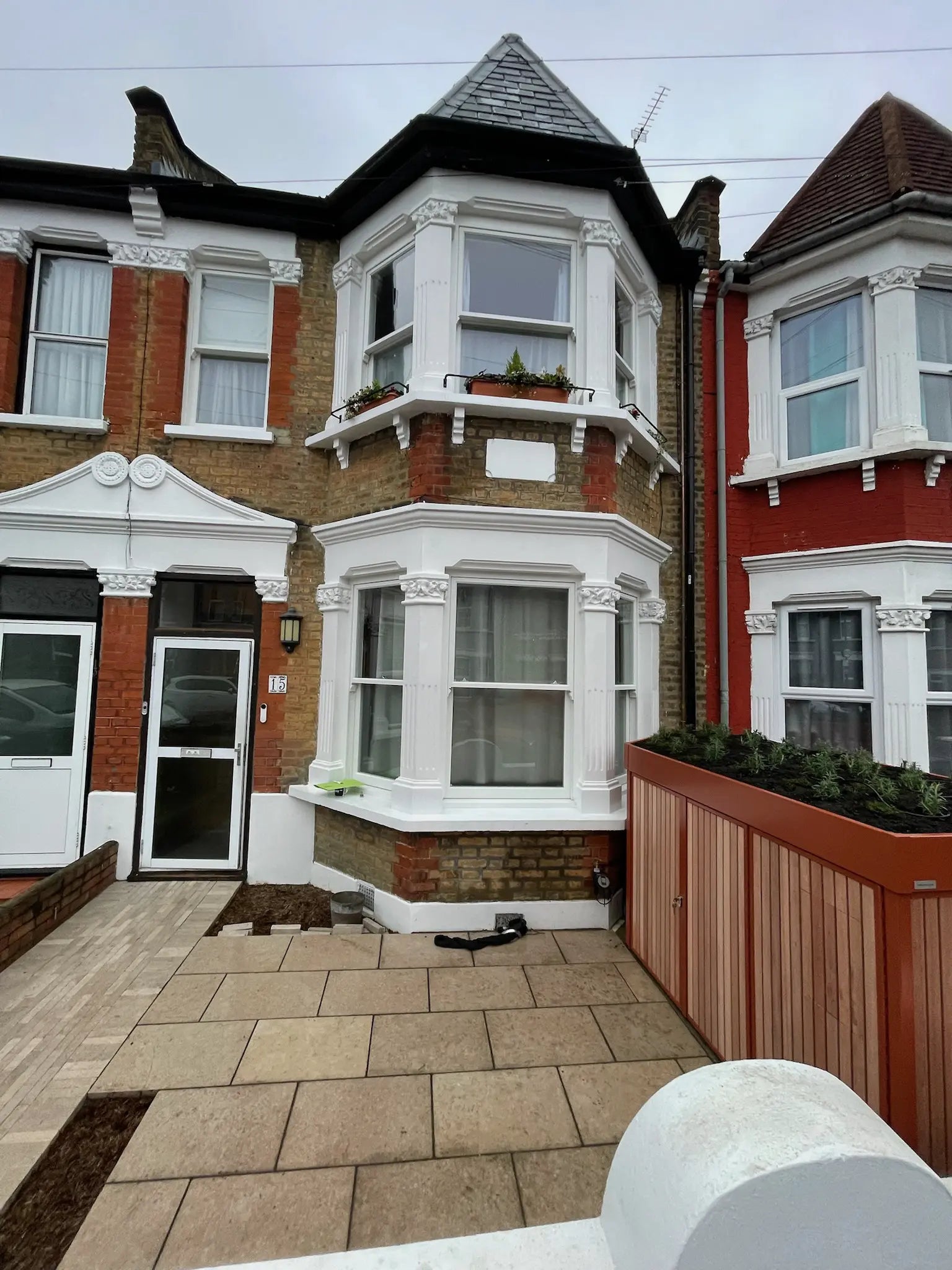 Front garden storage seamlessly integrated into the architecture of a London terraced property.