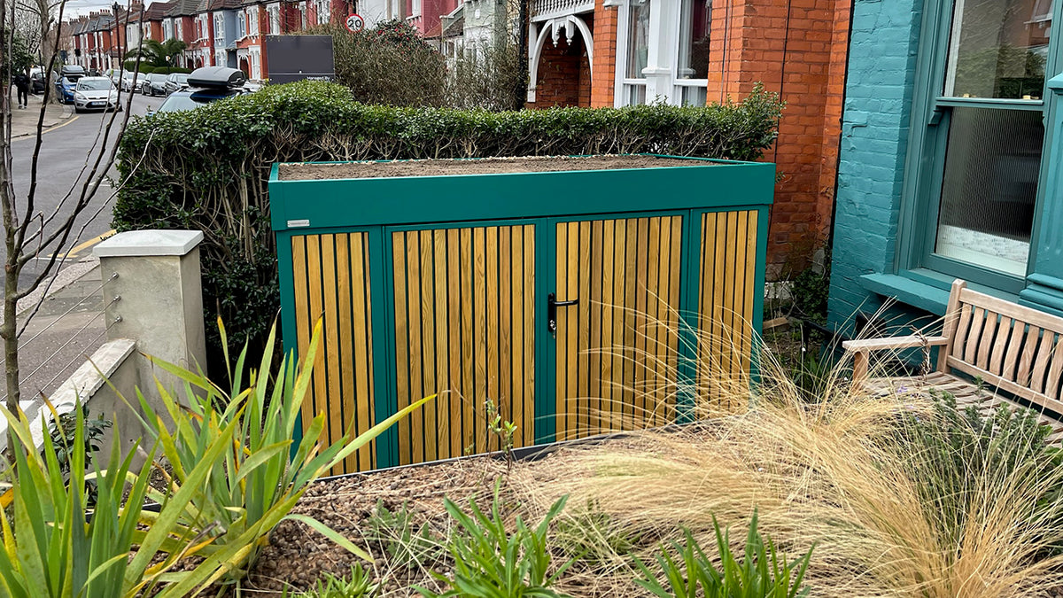 Front garden design incorporating a Sustainable Drainage System (SuDS) alongside a green roof bike shed